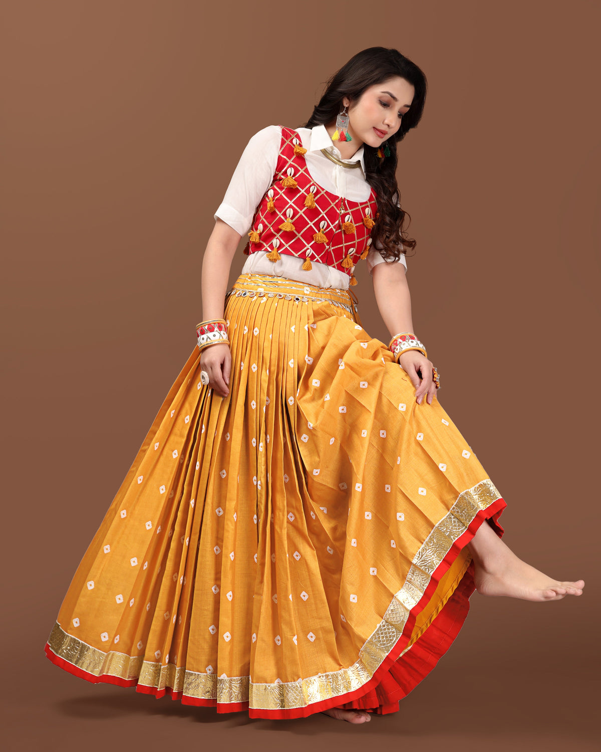 MUSTARD BANDHANI SKIRT WITH RED JACKET CHANIYA CHOLI RAAS'25 HANDMADEAHOLIC BY MISHKA