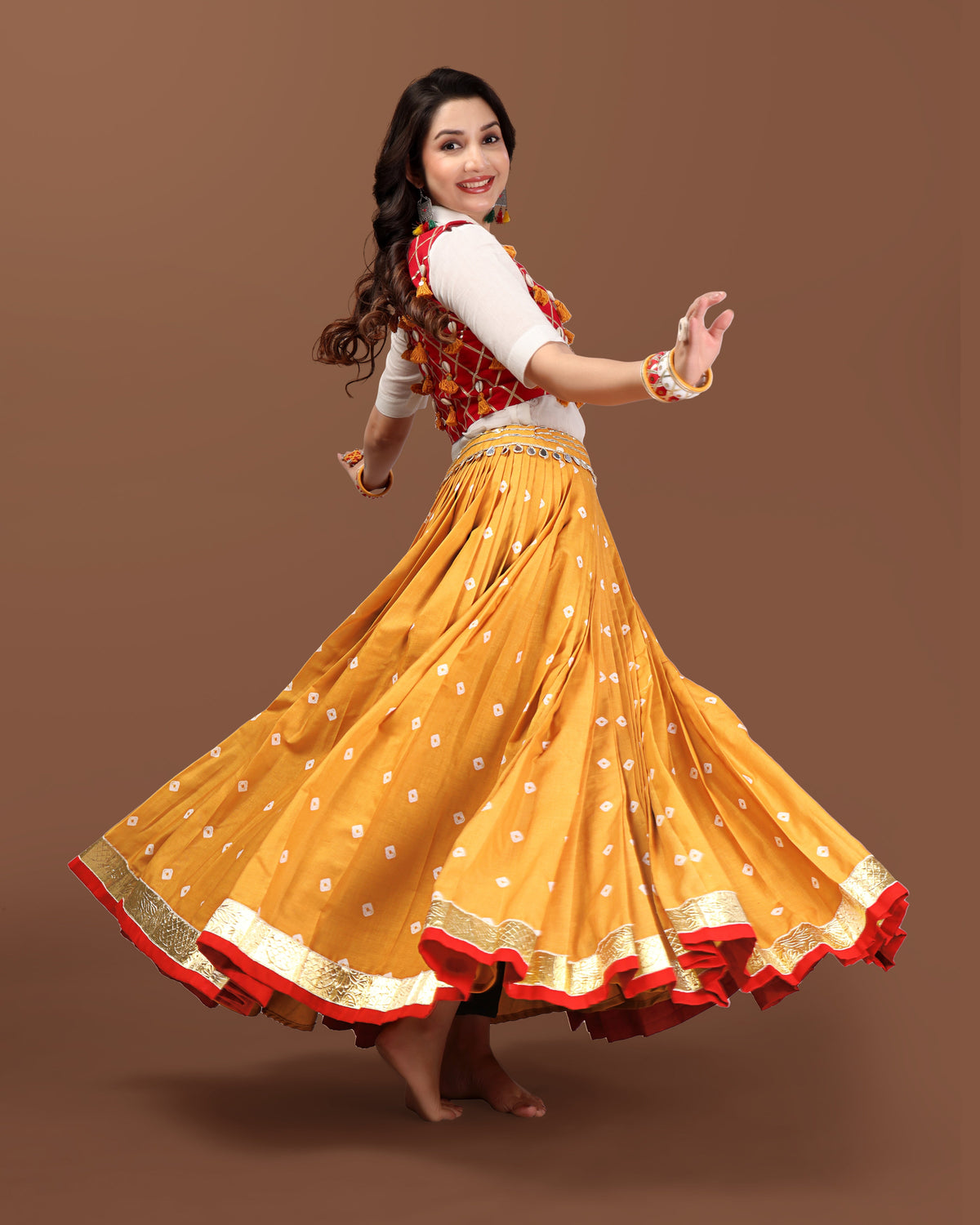 MUSTARD BANDHANI SKIRT WITH RED JACKET CHANIYA CHOLI RAAS'25 HANDMADEAHOLIC BY MISHKA